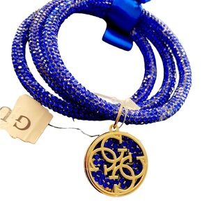 {Guess} Sparkly Rhinestone Bracelet Trio with Guess charm and bow